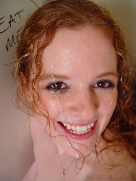 Young natural redhead Roxanna discovers gloryhole in bathroom & a cock as well 84709418