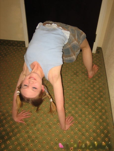 Adorable teen Kitty Kim strips naked behind a closed hotel room door 70180983