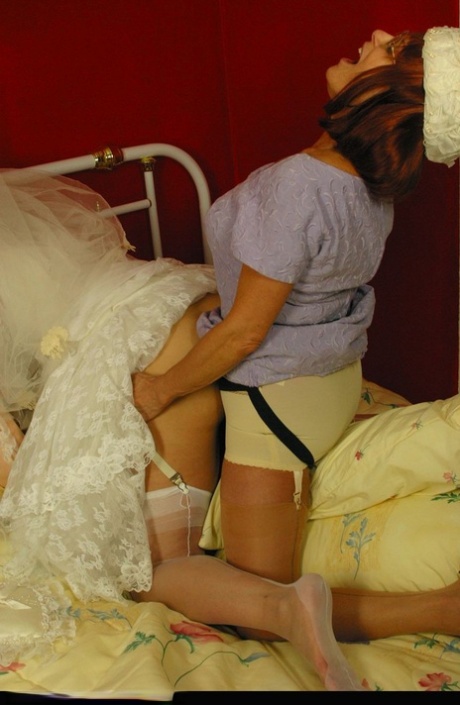 Hot bride Miss Abigail in stockings & high heels enjoys lesbian strapon fuck 52650372