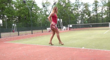 Bad girl Ani Black hikes her skirt on tennis court and lets the warm piss flow