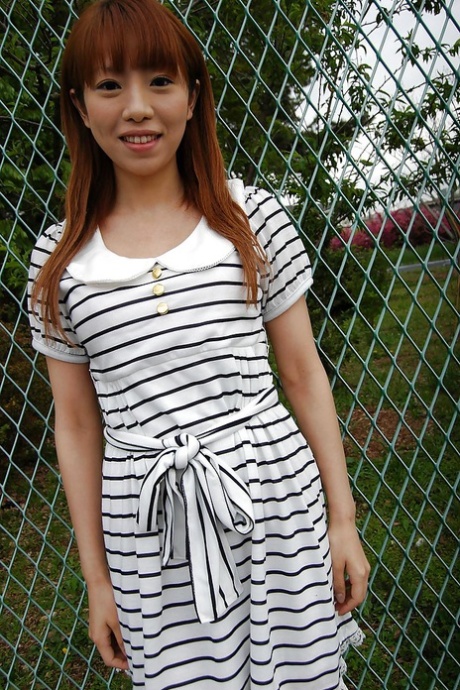 Asian Chihiro Ozawa is walking in her sexy striped dress outdoors 72482829