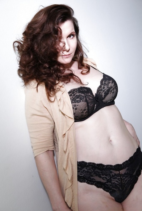 Older lady Nica Noelle removes black bra and panties to model in nude 15242061