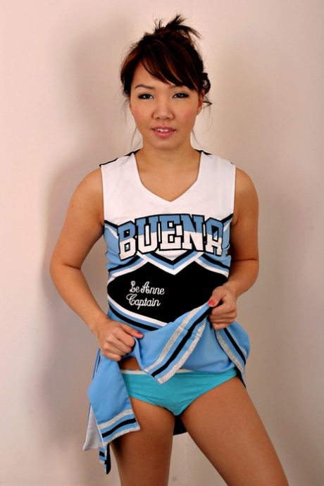Amateur Asian solo girl sheds cheerleader uniform to bare tiny teen tits 13314818