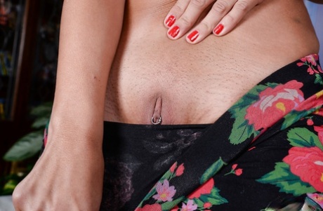 Aged brunette Jacky Fay-Lynn revealing pierced nipple and twat while disrobing 72763898