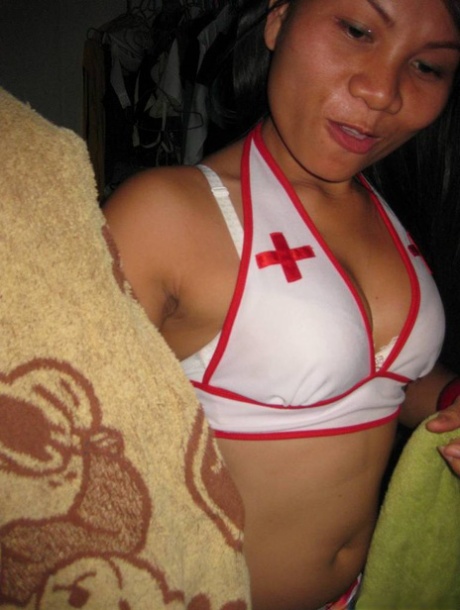 Tiny Thai female Ping removes nurse outfit before prostituting her tight pussy 44790360