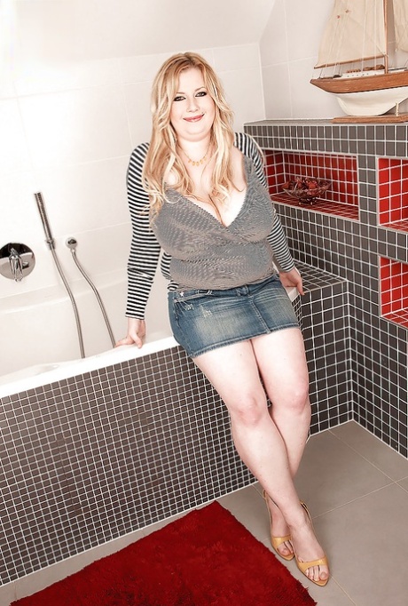 Fat blonde Anna Beck playing with her huge tits in the bathroom 90221934