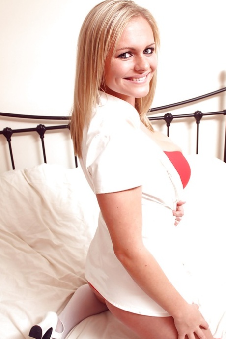 Curvaceous teen blonde taking off her nurse uniform and lingerie 79145251