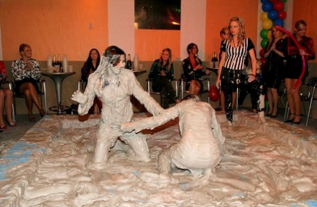 Seductive fetish ladies get involved in fully clothed mud wrestling 14397244