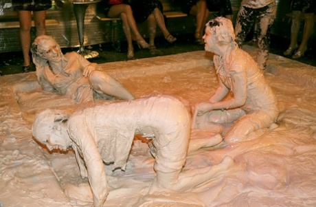 Fully clothed fetish lassies enjoy a messy catfight in the mud 26884496